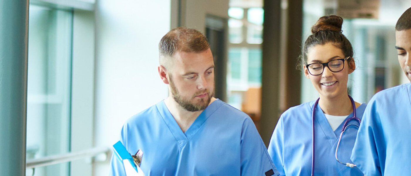 A group of students in scrubs
